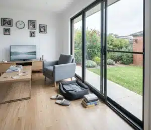 Same family room after a wide modern aluminium sliding door was fitted