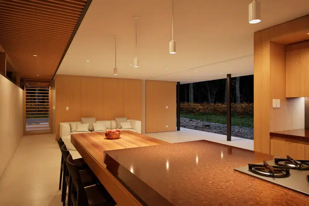 Modern bifold servery window folding open between kitchen bench and outdoor entertaining area