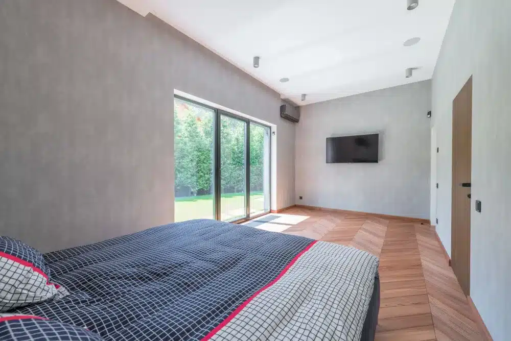 Sliding vs Stacking Doors: Which Is Right for You? 1 Aluminium sliding glass door connecting living room to outdoor entertaining area