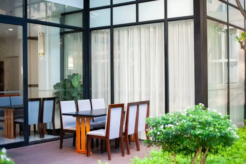 Wide aluminium stacking doors opening onto an alfresco area in a modern Australian home