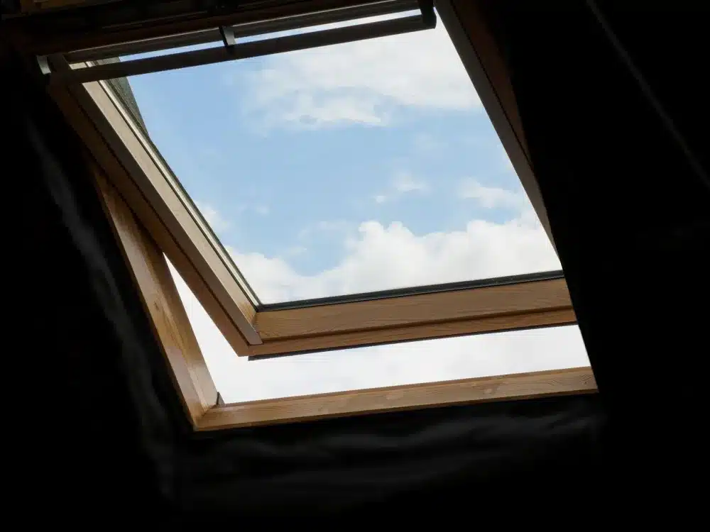 Awning vs Sliding Windows: How to Choose 1 Open aluminium awning window staying dry during rain on residential home