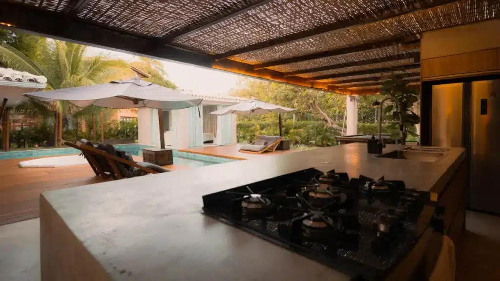 Aluminium bifold servery window opening kitchen to alfresco entertaining area in Camden NSW