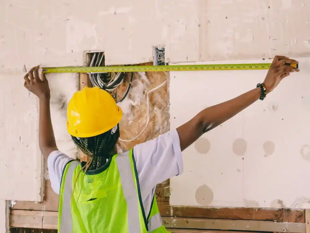 Bifold Servery Windows in Camden, NSW | Free Quote 4 Tradesperson measuring window opening for custom bifold servery window installation Camden NSW
