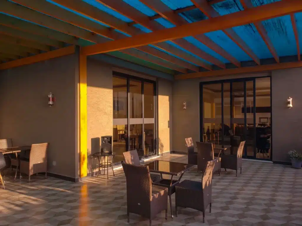 Double glazed aluminium sliding doors opening onto a patio in Liverpool NSW