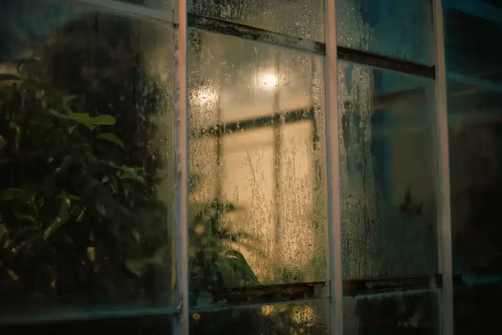 Low-E Glass vs Double Glazing: What Is the Difference? 4 Interior view of double glazed aluminium window reducing condensation in Australian home