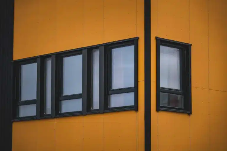 Low-E Glass vs Double Glazing: What Is the Difference? 32 Cross-section diagram comparing low-E glass and double glazing in aluminium window frames