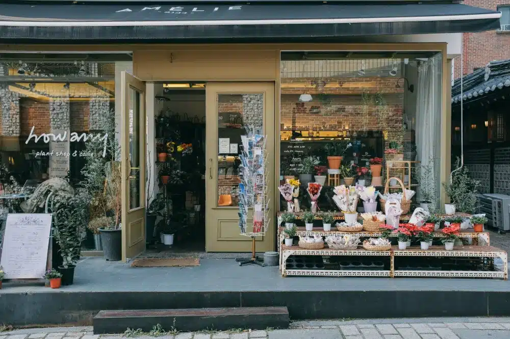 Shopfront Doors vs Apartment Entry Doors: The Differences 1 Shopfront vs apartment entry doors: Glass shopfront entrance with powder coated aluminium framing on a commercial building