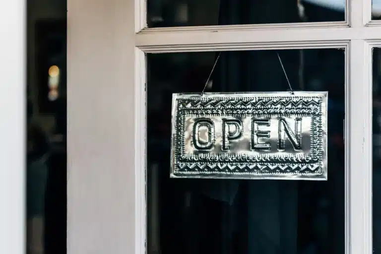 Shopfront Doors vs Apartment Entry Doors: The Differences 13 Commercial aluminium shopfront door installed at a modern retail premises in Smeaton Grange NSW