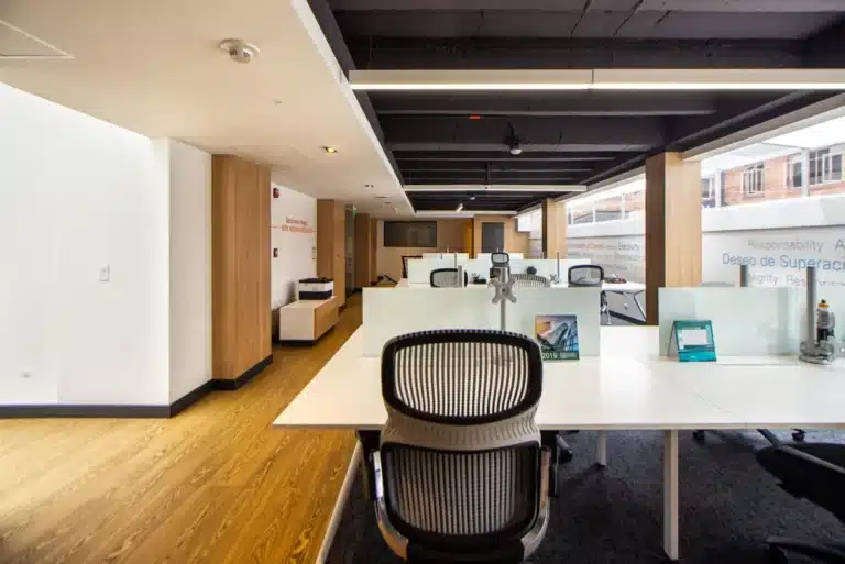 Frameless vs Framed Glass Office Partitions 14 Frameless glass office partitions dividing an open-plan workspace in Ingleburn NSW
